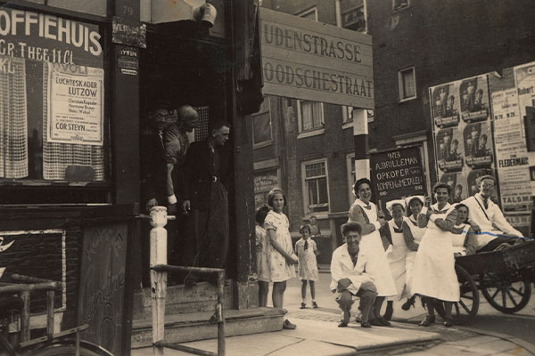 Jewish nurses and nursing students gather around a cart outside a coffee house on the designated Judenstrasse during the Nazi occupation of the Netherlands, circa 1940&ndash;42. US Holocaust Memorial Museum, courtesy of Clara Renee Keren Vromen