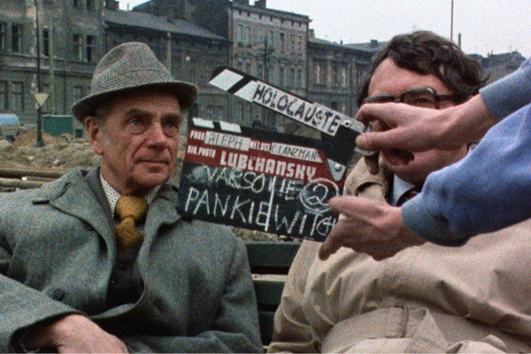 In 1979, Claude Lanzmann (right) interviews Tadeusz Pankiewicz (left), a Pole who ran a pharmacy within the confines of the Krakow ghetto and aided Jews. US Holocaust Memorial Museum, RG-60.5014