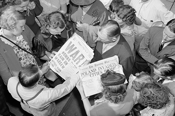 People look at Washington, DC, newspapers on September 1, 1939—the day Nazi Germany invaded Poland, starting World War II. Harris &amp; Ewing Collection/Library of Congress