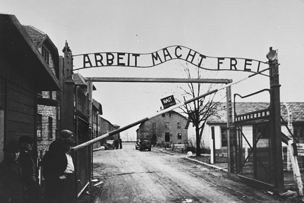 The entrance gate at Auschwitz bears the motto "Arbeit Macht Frei" (Work makes one free). Panstwowe Muzeum Auschwitz-Birkenau w Oswiecimiu