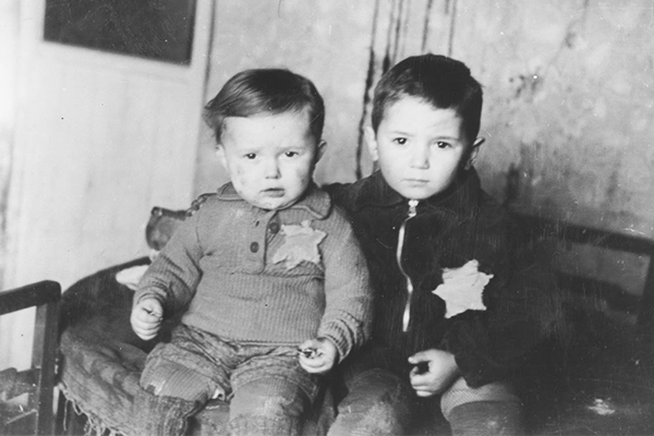 Brothers Emanuel and Avram Rosenthal wear yellow stars in the Kovno ghetto shortly before they were rounded up and killed in March 1944. Their uncle had asked for the photo to be taken and received a copy after the war. US Holocaust Memorial Museum, courtesy of Shraga Wainer