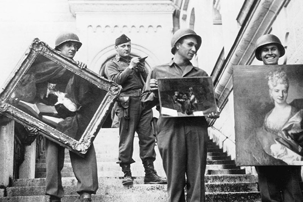 While serving in the US Army, Metropolitan Museum of Art curator James Rorimer supervises American GIs carrying paintings down the steps of the Neuschwanstein Castle in southern Germany in May of 1945. National Archives, provided by the Monuments Men Foundation for the Preservation of Art, Dallas 