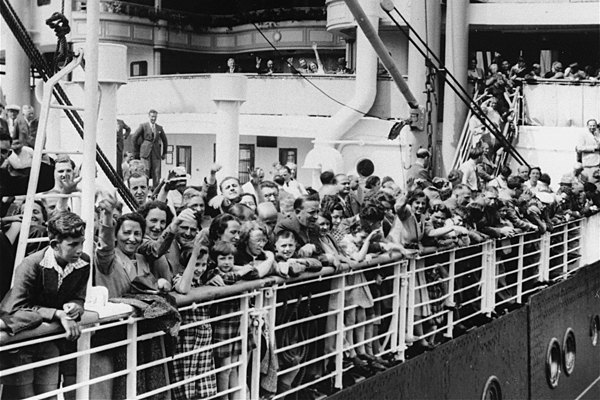 Jewish refugees stand on the deck of the MS St. Louis as the ship arrives in Antwerp in June 1939, returning to Europe after its passengers were not allowed to disembark in Cuba. US Holocaust Memorial Museum, courtesy of Bibliotheque Historique de la Ville de Paris