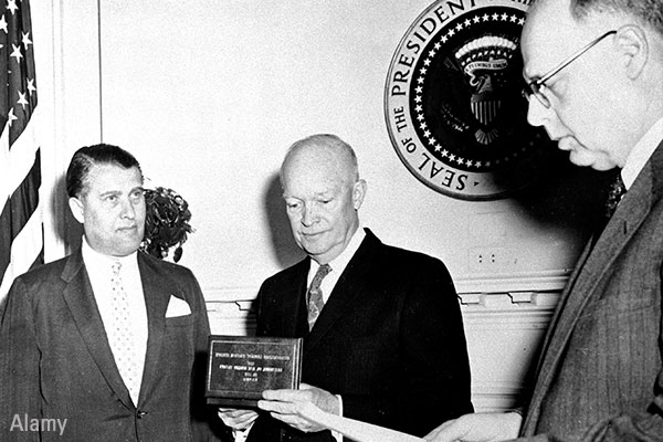 Rocket scientist Wernher von Braun (left), a former Nazi, receives a federal civilian service award from President Dwight D. Eisenhower circa 1959. Alamy