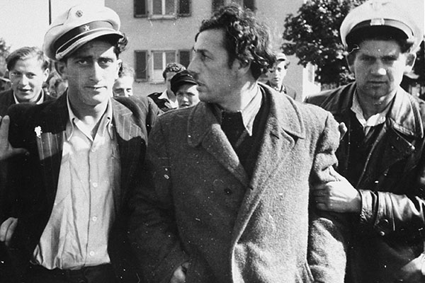 Jewish police detain a former Kapo who was recognized in the street at the Zeilsheim displaced persons camp, 1945&ndash;48. US Holocaust Memorial Museum, courtesy of Alice Lev