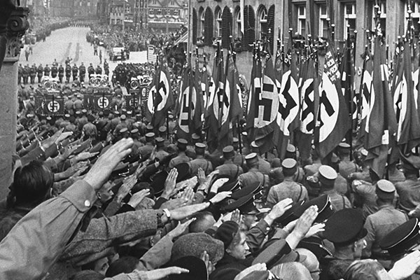 Spectators cheer passing SA formations during a Reichsparteitag (Reich Party Day) parade, 1937.&nbsp;US Holocaust Memorial Museum, courtesy of bpk-Bildagentur