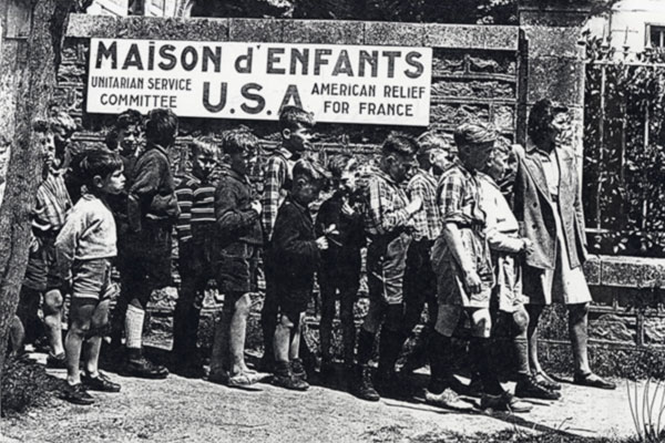 French children wait in line for assistance from the Unitarian Service Committee in France, circa 1939–1941. Unitarian Universalist Service Committee